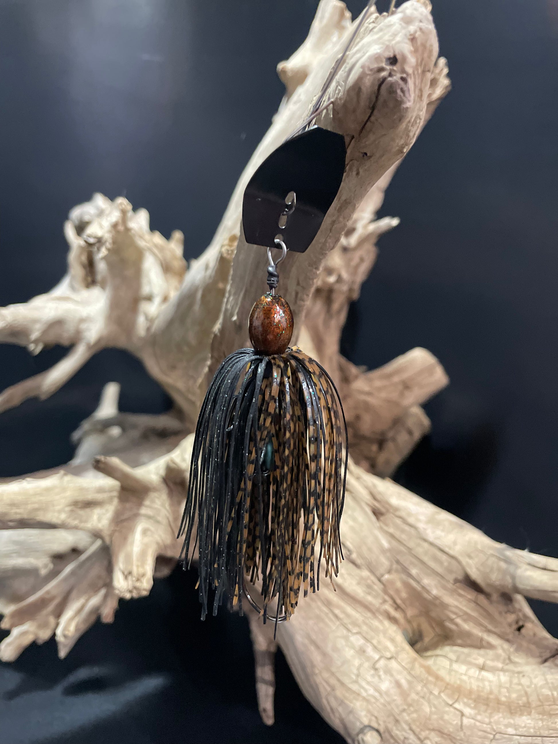 Experience unparalleled performance with Bogspawn. Our black and brown Chatterbait fishing lure features a 3/8 oz weight and a #4/0 hook for optimal precision and control. Choose between a black or silver blade for a customizable fishing experience.