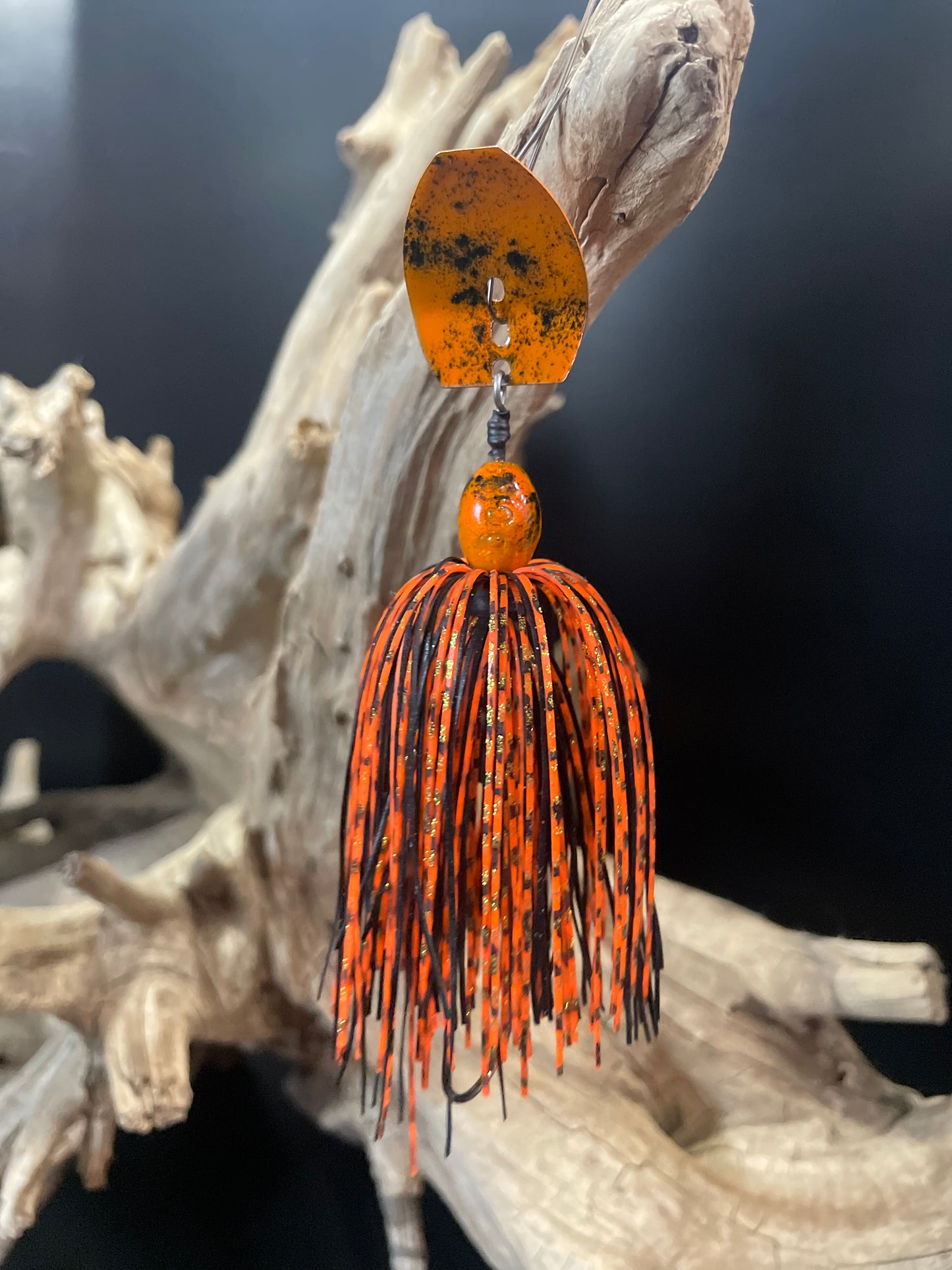 Expertly designed for optimal fishing, our Jack'd Up Black and Orange Bass Chatterbait fishing lure offers top-of-the-line features. With a 3/8 oz weight and a #4/0 hook, this bait provides precision and versatility. Choose between a Black or Silver blade for maximum customization.