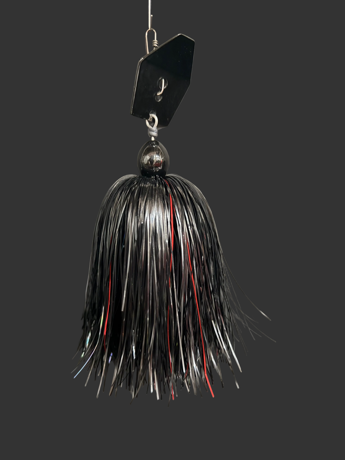 Muskie Fishing lure with a black, red and Silver skirt. made in Brantford Ontario, Canada by Lure-Cifer