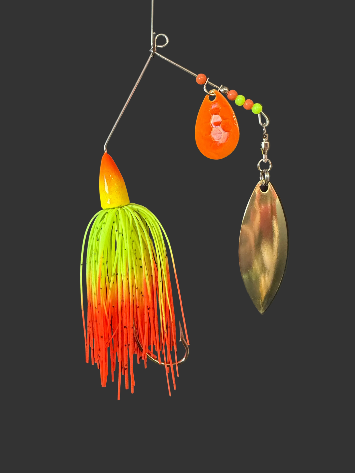 Expertly designed for maximum bass-catching potential, the Neon Spirit boasts a 3/8 oz Bass Spinnerbait fishing lures with a #5 Willow Blade featuring UV glow for increased visibility. The sharp #4/0 hook ensures a secure catch. Available in vibrant chartreuse/yellow and orange.