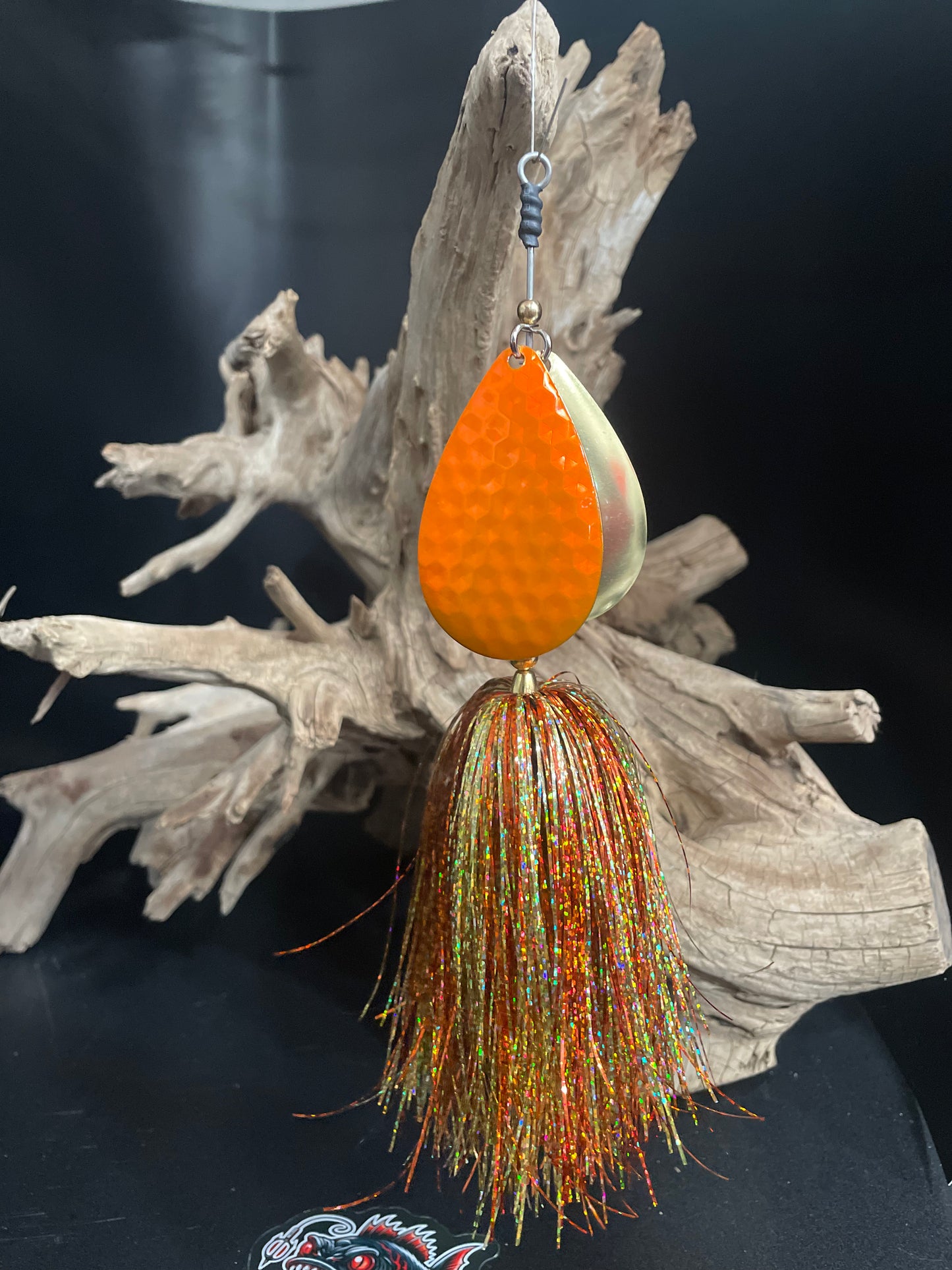 Muskie Bucktail with an orange and gold blade and orange and gold skirt.