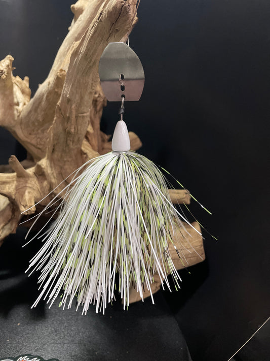 The Shadow Walker is a 1 oz head chatterbait designed for optimal fishing performance. Its unique white, black, and chartreuse stripped design, paired with a #7/0 hook, will attract a wide range of fish species. Its versatility and reliability make it a must-have for any angler looking for success on the water.
