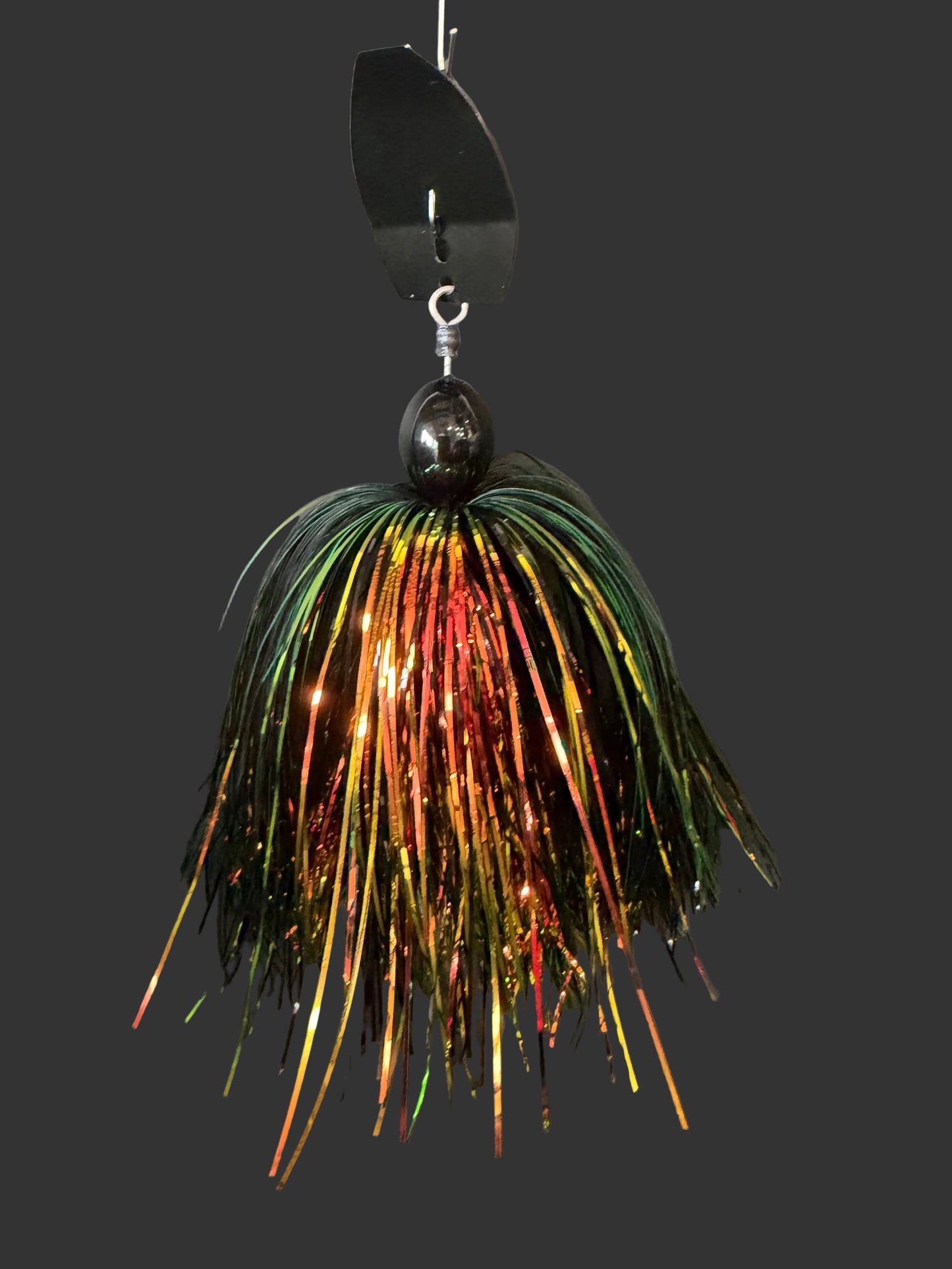 Muskie chatterbait fishing lure with a black blade and a green, orange and black skirt. available in 1oz-30z made by Lure-cifer Lures on Brantford Ontario, Canada