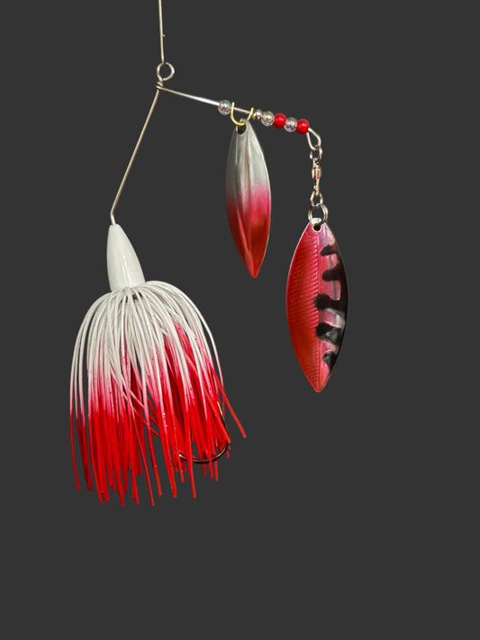 3/8oz White and Red spinnerbait with #4.5 and #5 Willow blades. UV glow and wired skirt. #3/0 hook with snap ring. Great for catching bass