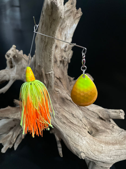 Orange & Chartreuse 3/8 oz spinnerbait with #5 Colorado Blade and a #3/0 hook. Wired Skirt and snap ring.  Built for visibility, strength, and serious strikes. Made to perform in all waters.