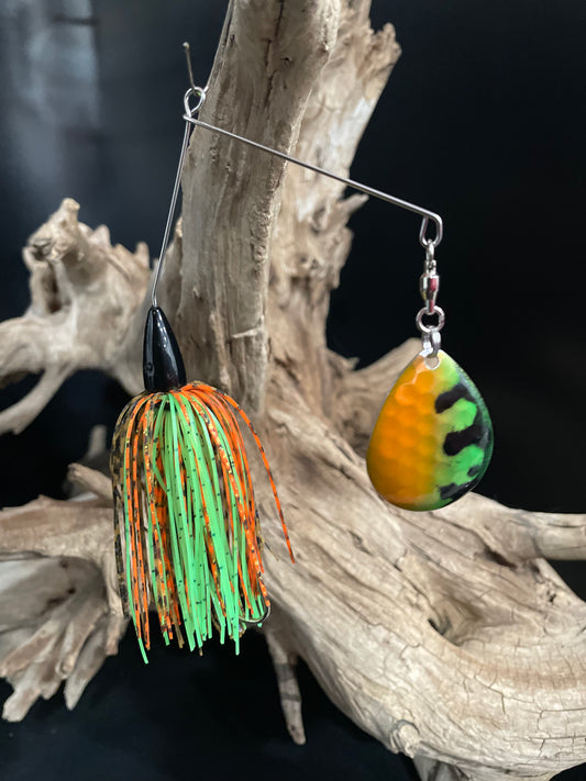 Orange & Lime Green 3/8 oz spinnerbait with #5 Colorado Blade and a #3/0 hook. Built for visibility, strength, and serious strikes. Made to perform in all waters. Great to catch bass