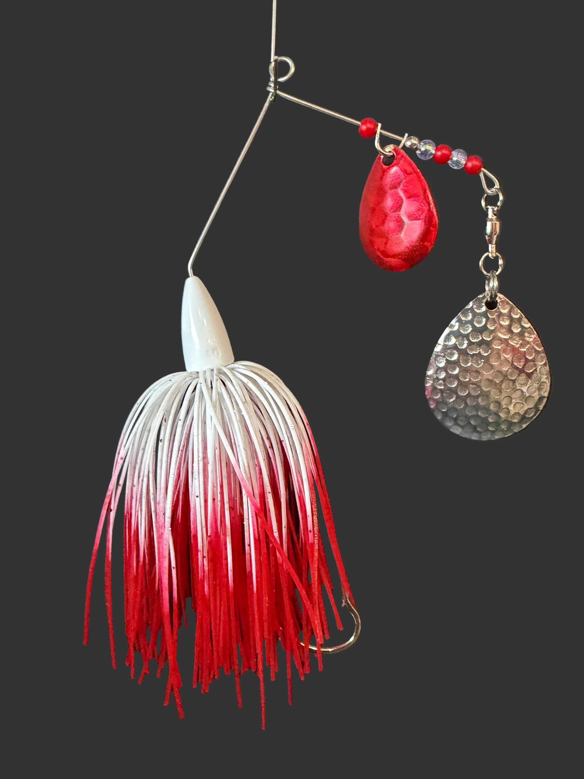 This Red and White Bass Spinnerbait fishing lure features a 3/8 oz weight and a #4/0 hook, 