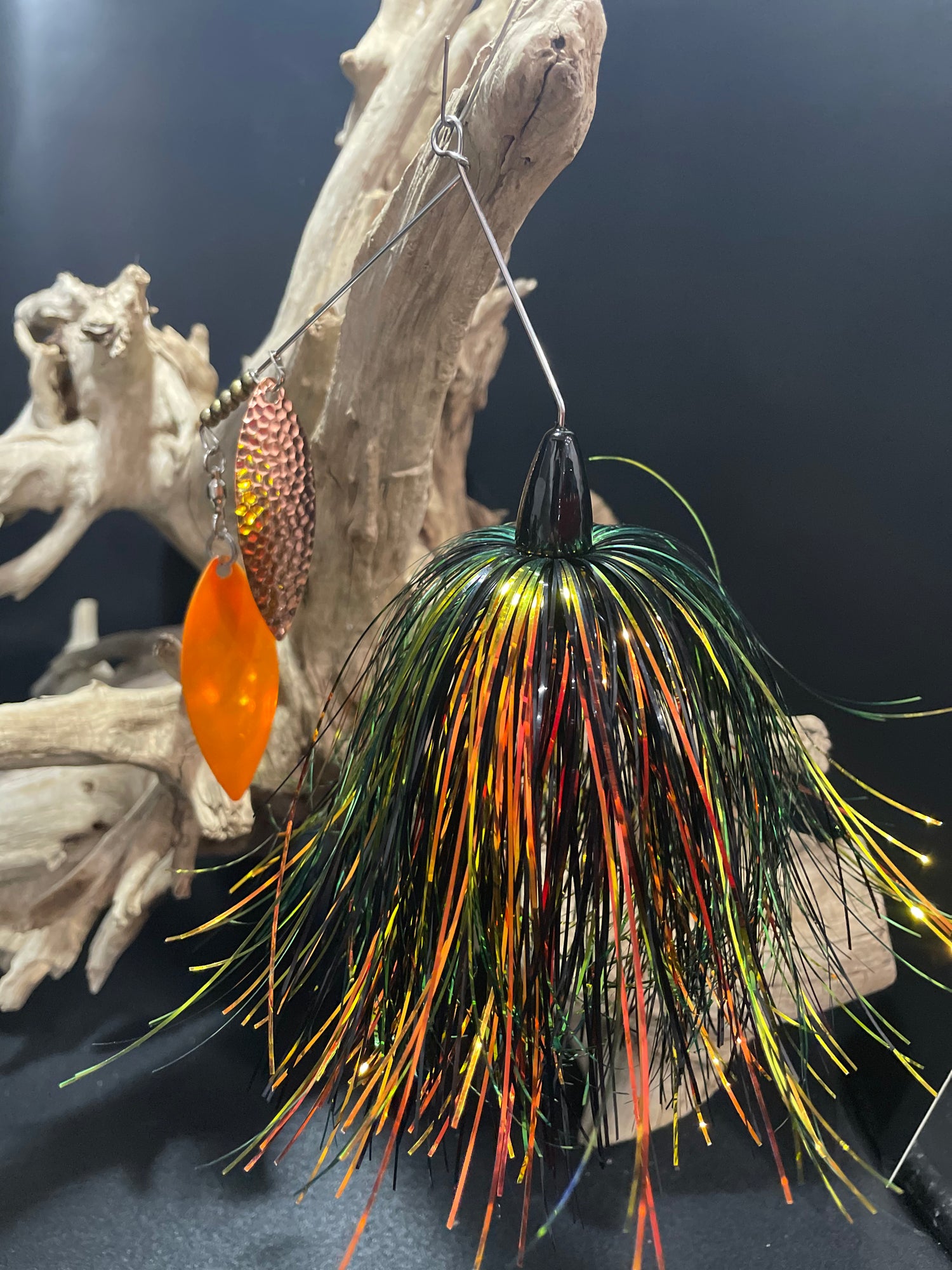 Introducing Crypt Spark - the ultimate spinnerbait for avid anglers. With a sleek black, green, and orange design, this 1 oz lure features a #6 willow blade, a #5 hammered copper willow blade, and a #7/0 hook with .051 wire. Catch more fish with Crypt Spark. Brantford Ontario Canada