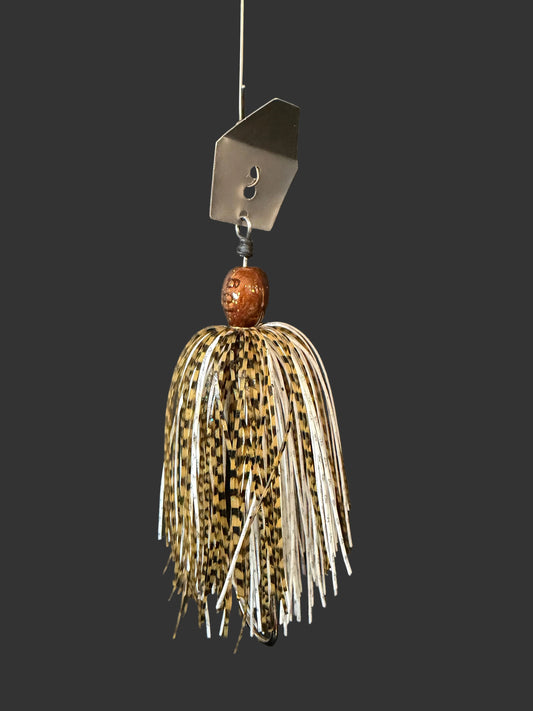 Introducing Dust Devil, the ultimate Chatterbait fishing lure for anglers. Designed with a sleek white and brown colour scheme, this 3/8 oz bait is perfect for catching a variety of fish. Its #4/0 hook and black blade ensure maximum hooking power. Upgrade your fishing game with Dust Devil.