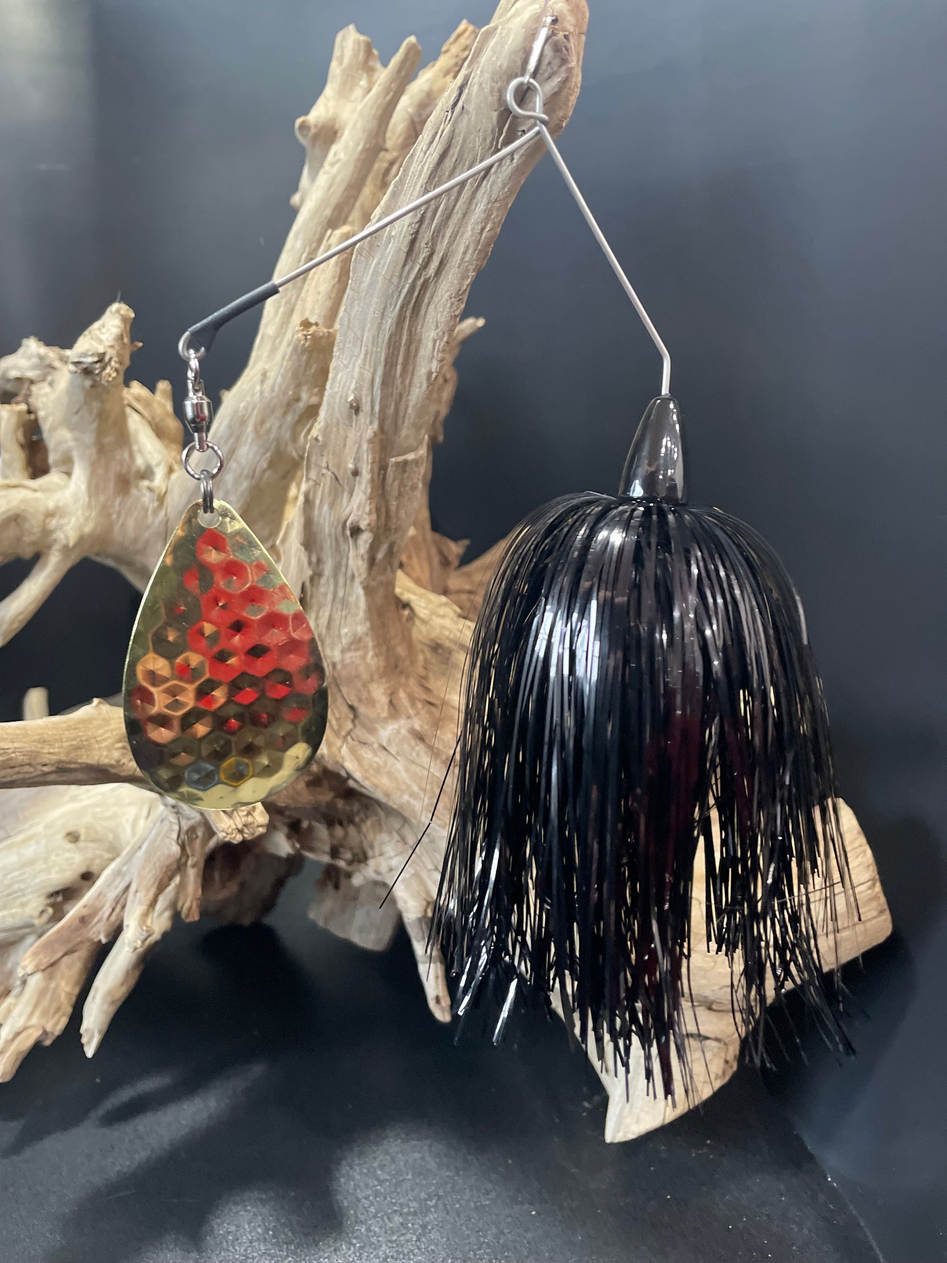 The Grimm Reaper is the ultimate angler's tool. This 1oz Muskie/Pike Spinnerbait boasts a formidable #8 Colorado Hex Blade and a sturdy #7/0 hook. Designed for maximum lure and secure hook-set, this black beauty guarantees to reel in the big ones. Pro-Tec clear blades for durability and to prevent corrosion.