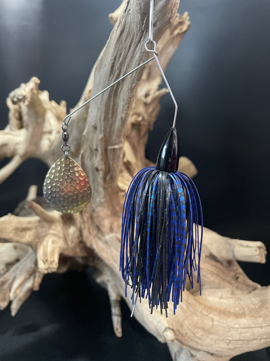 A 3/8 oz Bass Spinnerbait fishing lure, designed with a blue and black colour combination to attract fish in any water condition. Its #6 Colorado Blade and #4/0