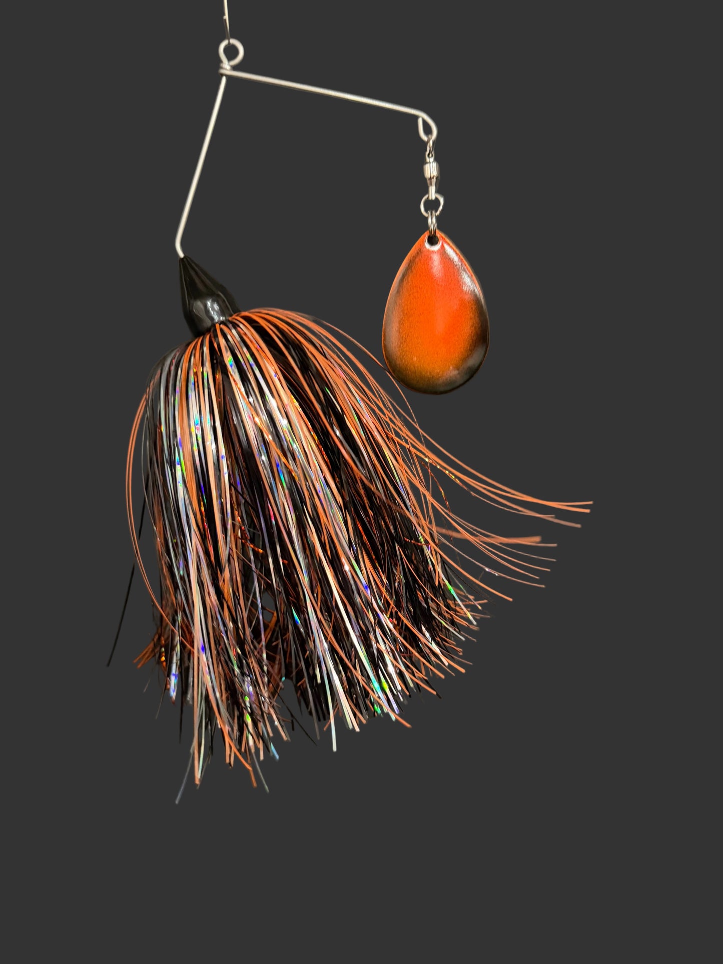 Muskie/Pike Spinnerbait fishing lure with a black and orange skirt and blade