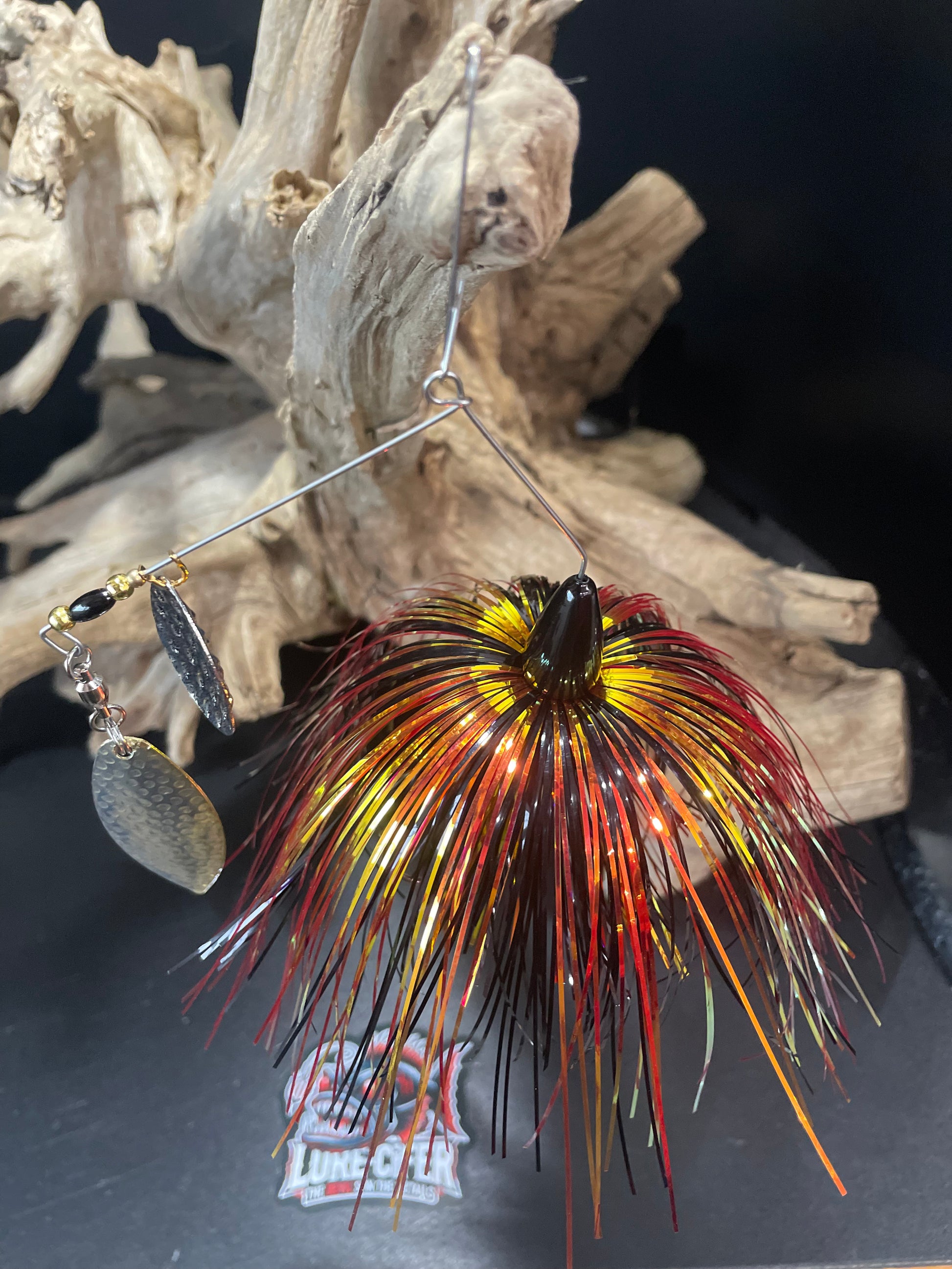 Introducing Hellfire - the ultimate Bass Spinnerbait for avid anglers! Combining a #5 Willow UV Glow Blade with a #5/0 hook, this award-winning lure boasts unmatched strength and durability. Choose from 1/2 oz or 3/4 oz sizes and experience the power of black, red, and gold colours. Top Angle