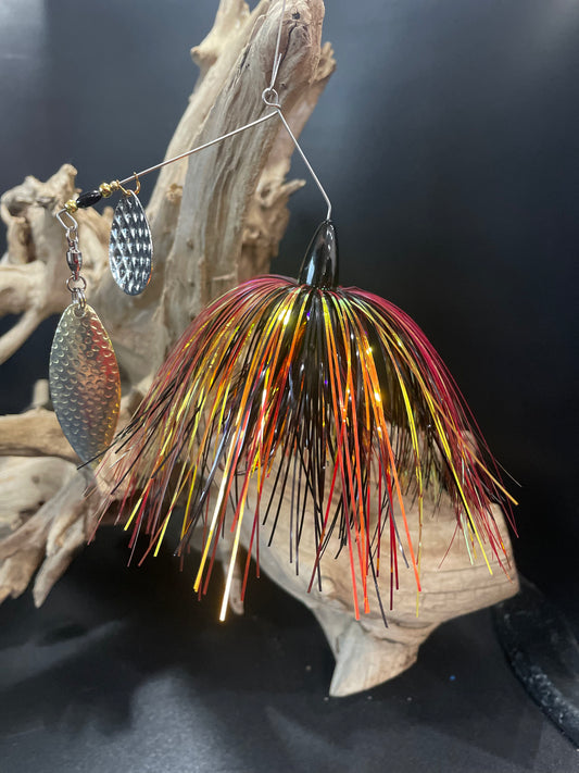 Introducing Hellfire - the ultimate Bass Spinnerbait for avid anglers! Combining a #5 Willow UV Glow Blade with a #5/0 hook, this award-winning lure boasts unmatched strength and durability. Choose from 1/2 oz or 3/4 oz sizes and experience the power of black, red, and gold colours. front angle