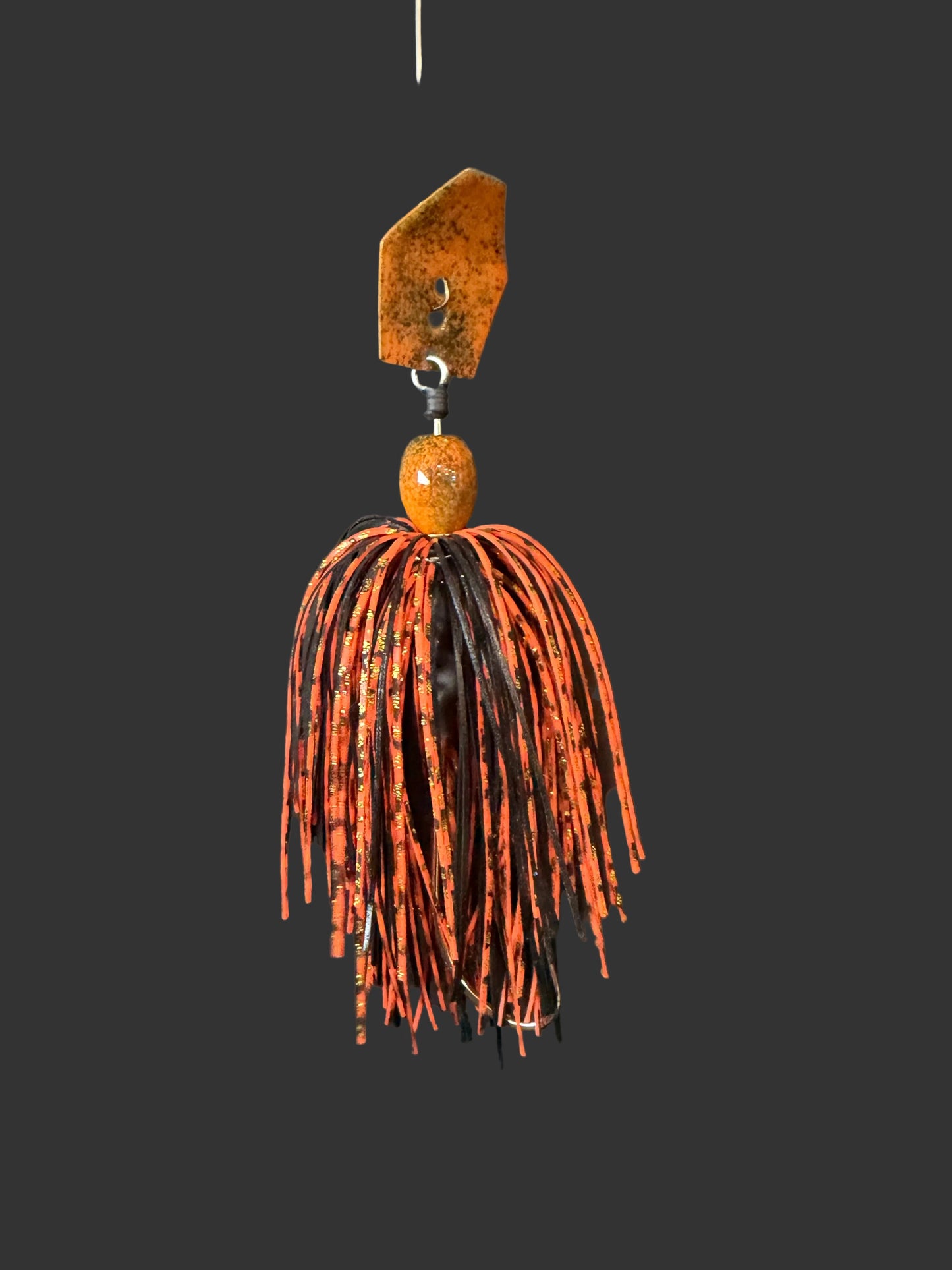 Expertly designed for optimal fishing, our Jack'd Up Black and Orange Bass Chatterbait fishing lure offers top-of-the-line features. With a 3/8 oz weight and a #4/0 hook, this bait provides precision and versatility. Choose between a Black or Silver blade for maximum customization.