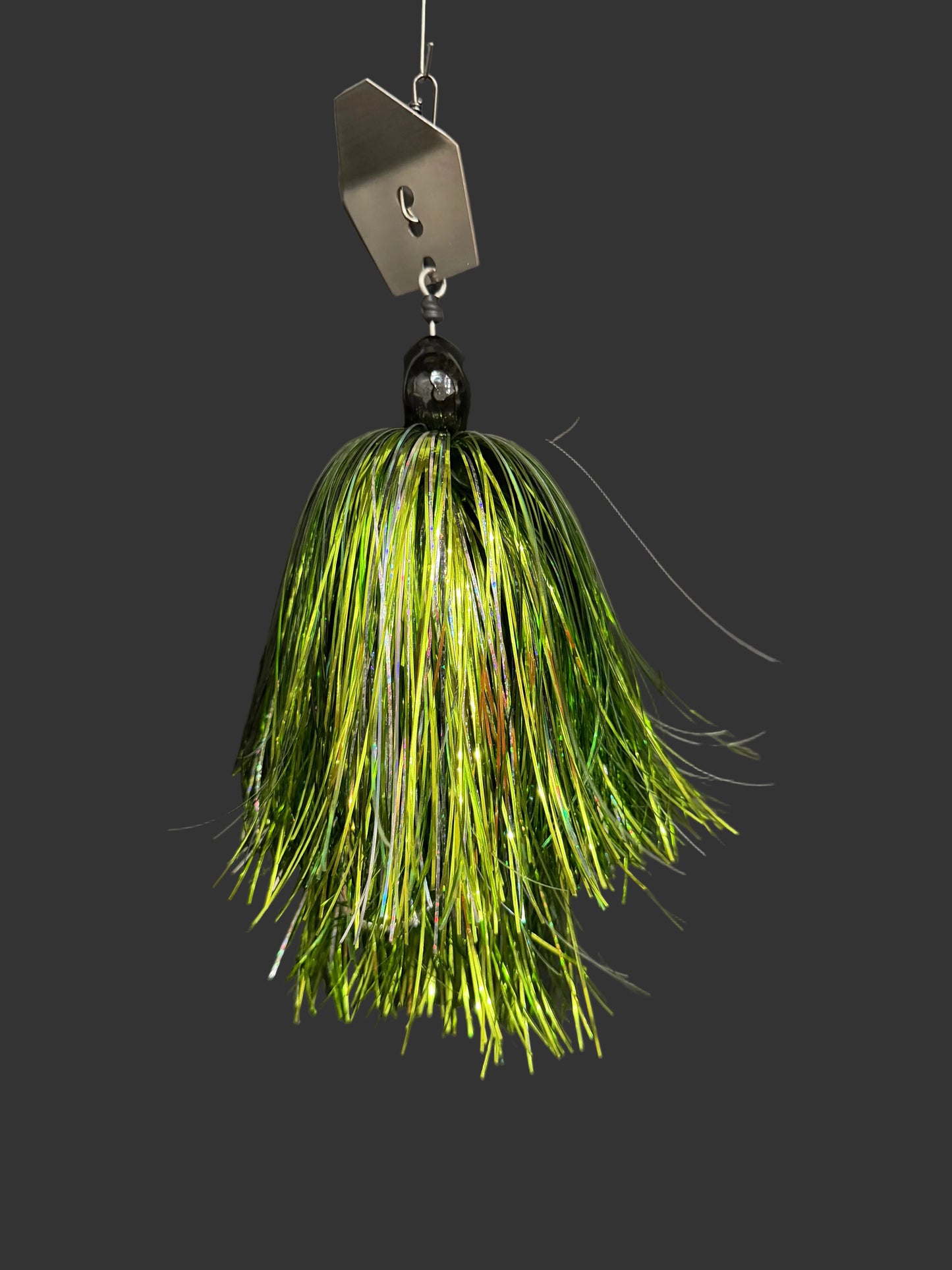 Muskie chatterbait fishing lure with a silver blade and a light green and silver skirt. Made by Lure-cifer in Brantford Ontario Canada