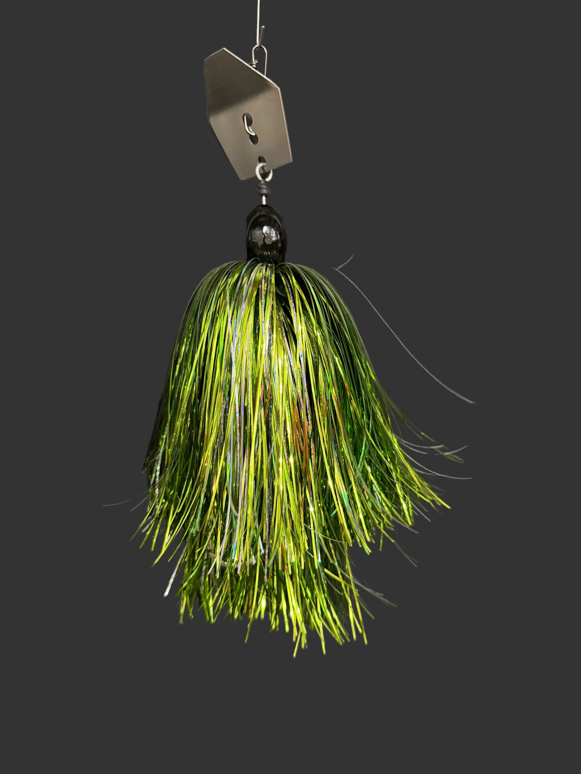 Muskie chatterbait fishing lure with a silver blade and a light green and silver skirt. Made by Lure-cifer in Brantford Ontario Canada