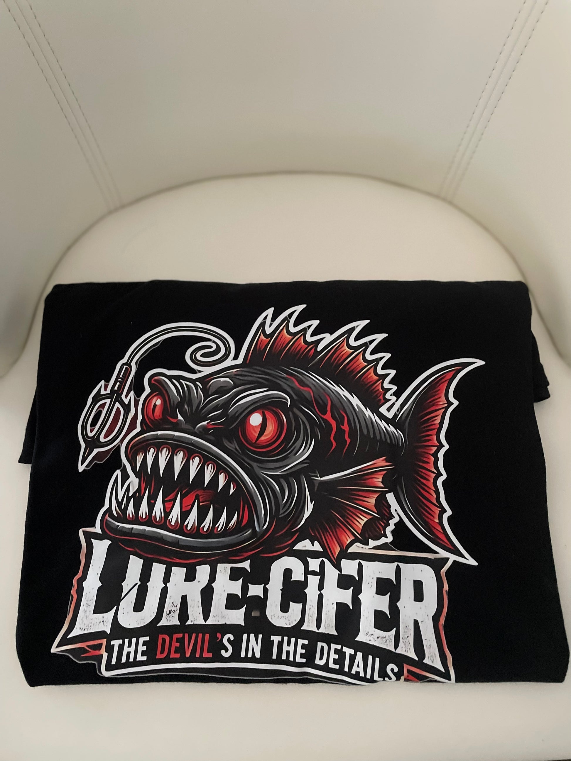 Black t-shirt with a deep sea Anglerfish with the tag line, "The Devil's in the Details"