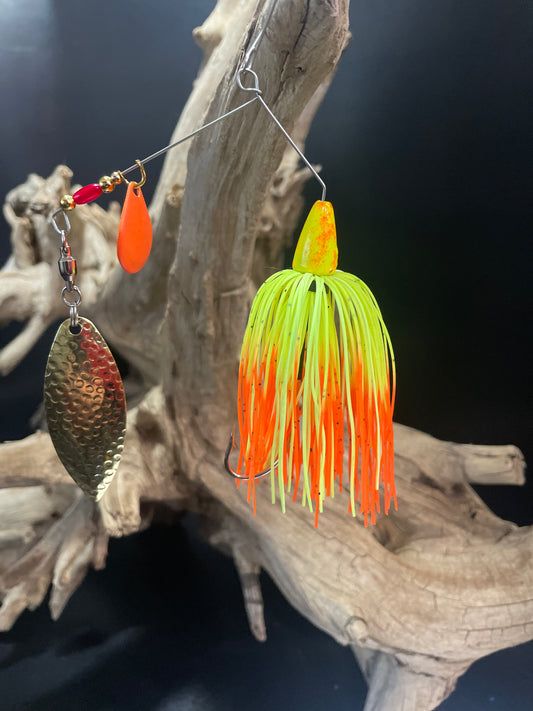 Expertly designed for maximum bass-catching potential, the Neon Spirit boasts a 3/8 oz Bass Spinnerbait fishing lures with a #5 Willow Blade featuring UV glow for increased visibility. The sharp #4/0 hook ensures a secure catch. Available in vibrant chartreuse/yellow and orange.