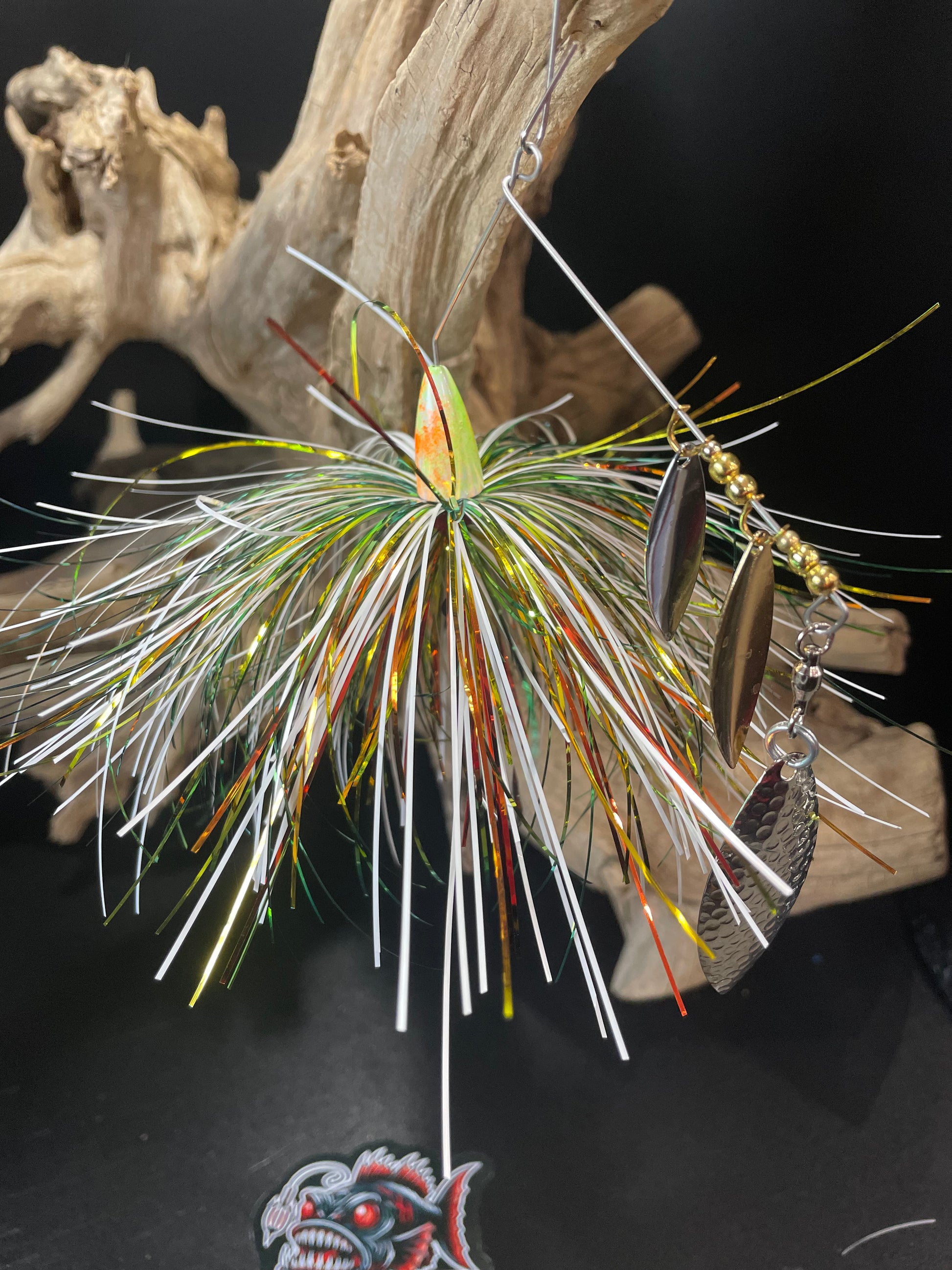 The Nuclear Triple Threat is a bass spinnerbait fishing lure equipped with triple willow blades and a #5/0 hook. Available in 1/2 oz and 3/4 oz, this spinnerbait offers increased chances of catching fish and versatility in weight options. A must-have for any serious angler.