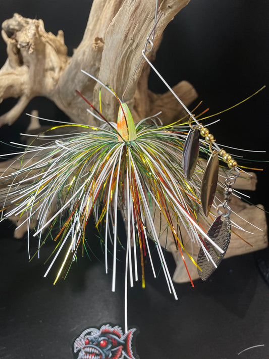 The Nuclear Triple Threat is a bass spinnerbait fishing lure equipped with triple willow blades and a #5/0 hook. Available in 1/2 oz and 3/4 oz, this spinnerbait offers increased chances of catching fish and versatility in weight options. A must-have for any serious angler.