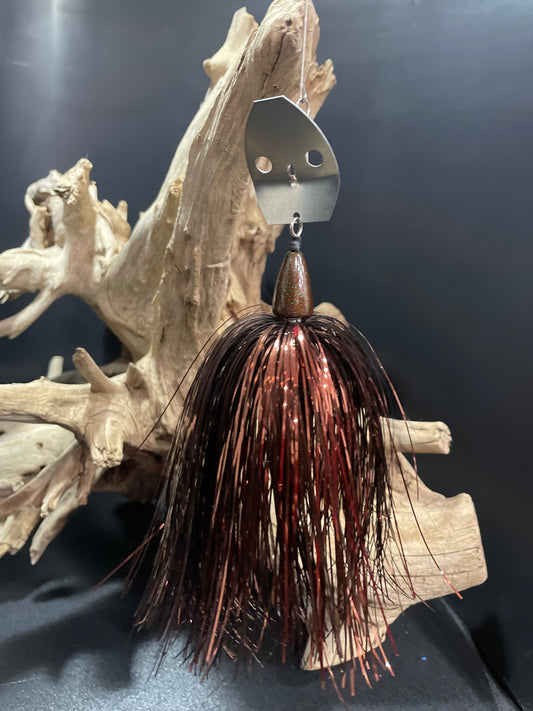Introducing Phantom Forge, the ultimate fishing lure for targeting muskies. With a 1 oz head and #7/0 hook, it's designed for success. The bronze skirt and bubble hole blade create an irresistible vibration, increasing your chances of landing the big one. Upgrade your fishing game with Phantom Forge.