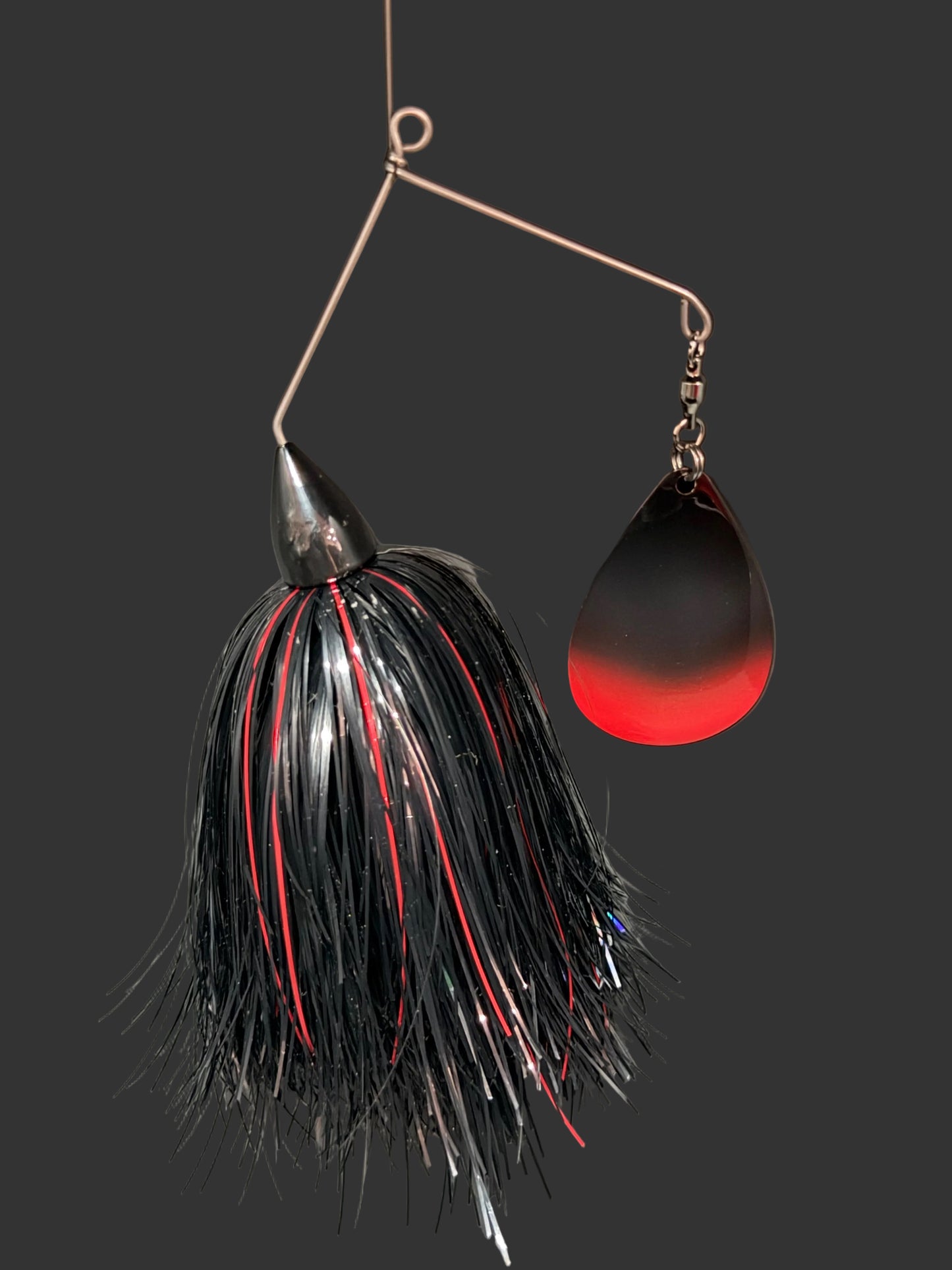 A red, black and Silver Muskie Spinnerbait