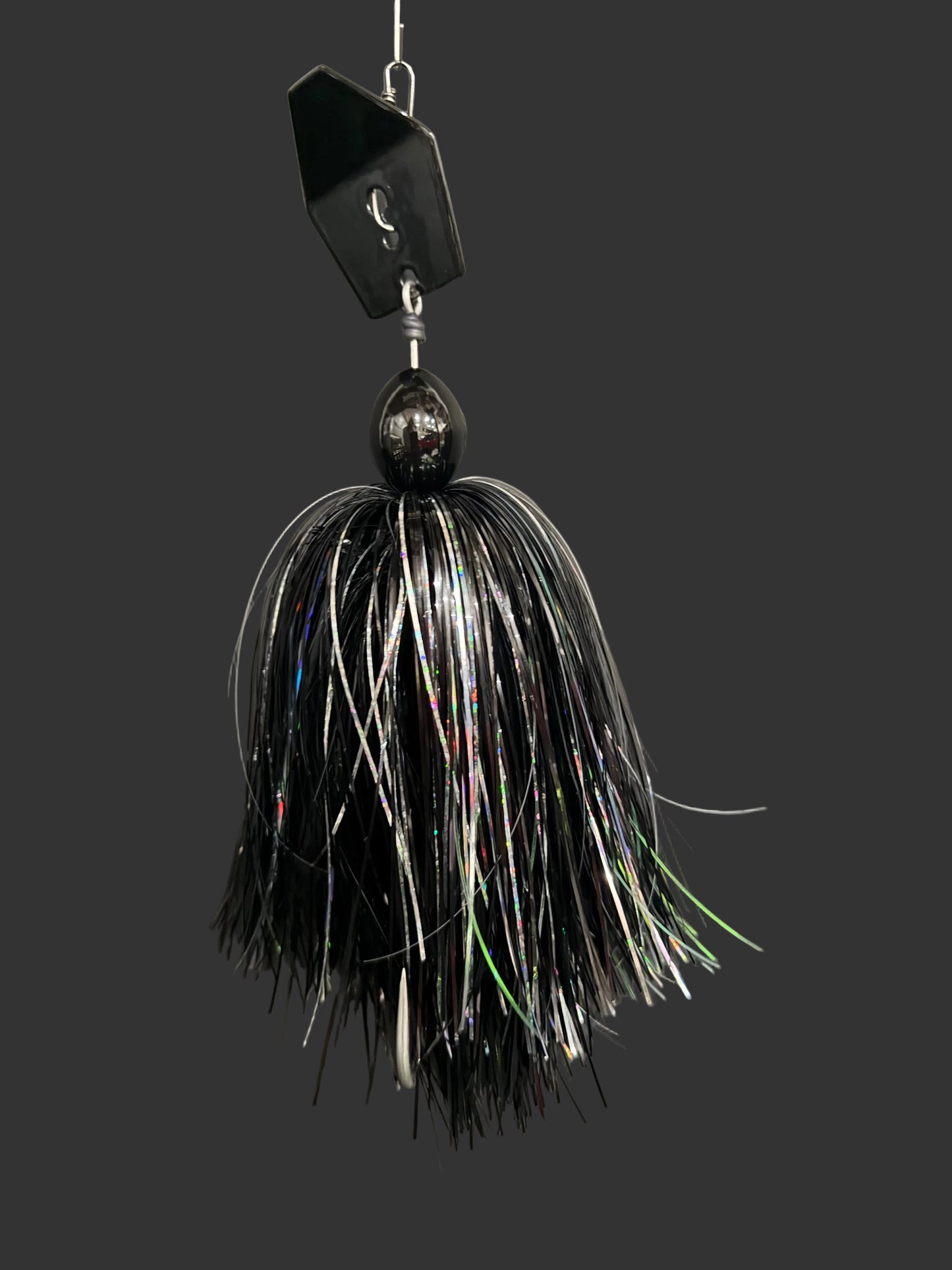 Black and white fishing lure on a gray background