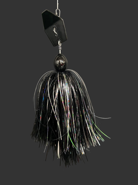 Black and white fishing lure on a gray background