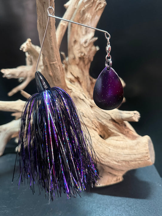 Muskie Spinnerbait with a black and purple skirt with silver accents. A deep purple blade with silver sparkle 