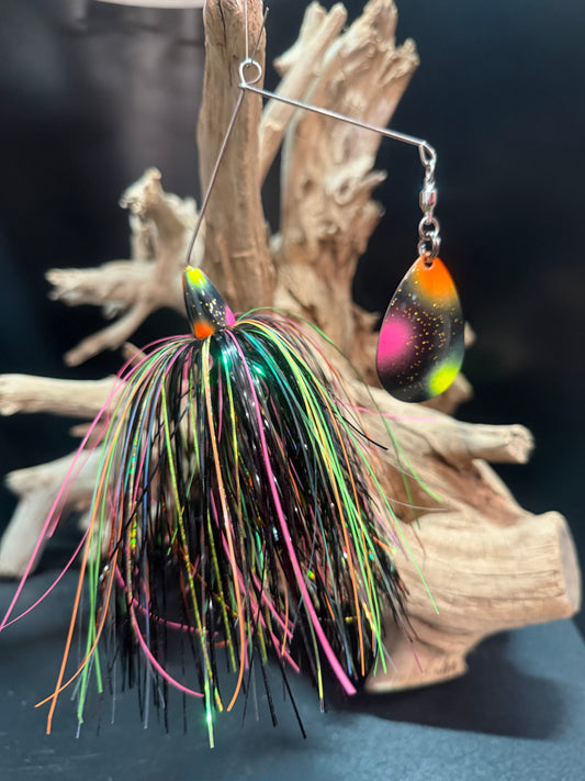 Muskie Spinnerbait with a black, pink, orange, and chartreuse skirt with a #8 colorado blade