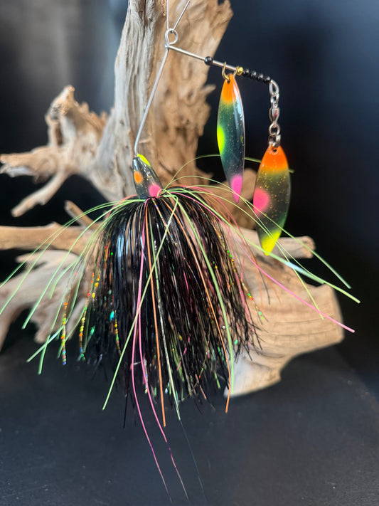 Muskie Spinnerbait with a Black, pink, orange and chartreuse skirt and 2 dual #6 willow blades. Designed to catch. Built to last. 