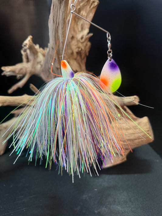 Wicked Wonder is a Muskie Spinnerbait with a white, chartreuse, purple and orange skirt, a #8 Colorado Blade and a #9/0 replaceable hook